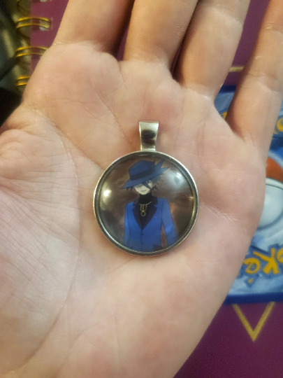 Trainer Riley Pendant or Keychain - 25mm Round Video Game Jewelry Accessory